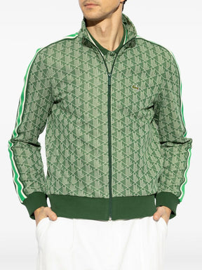 Casaco verde com padronagem monogramada