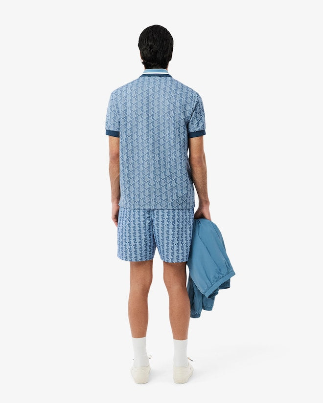 Shorts de banho de comprimento médio com estampa de monograma